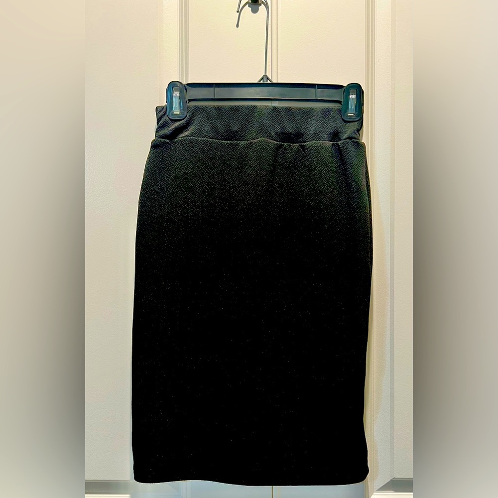 NWOT. Women’s high waisted, knee length pencil skirt. Elastic waistband.